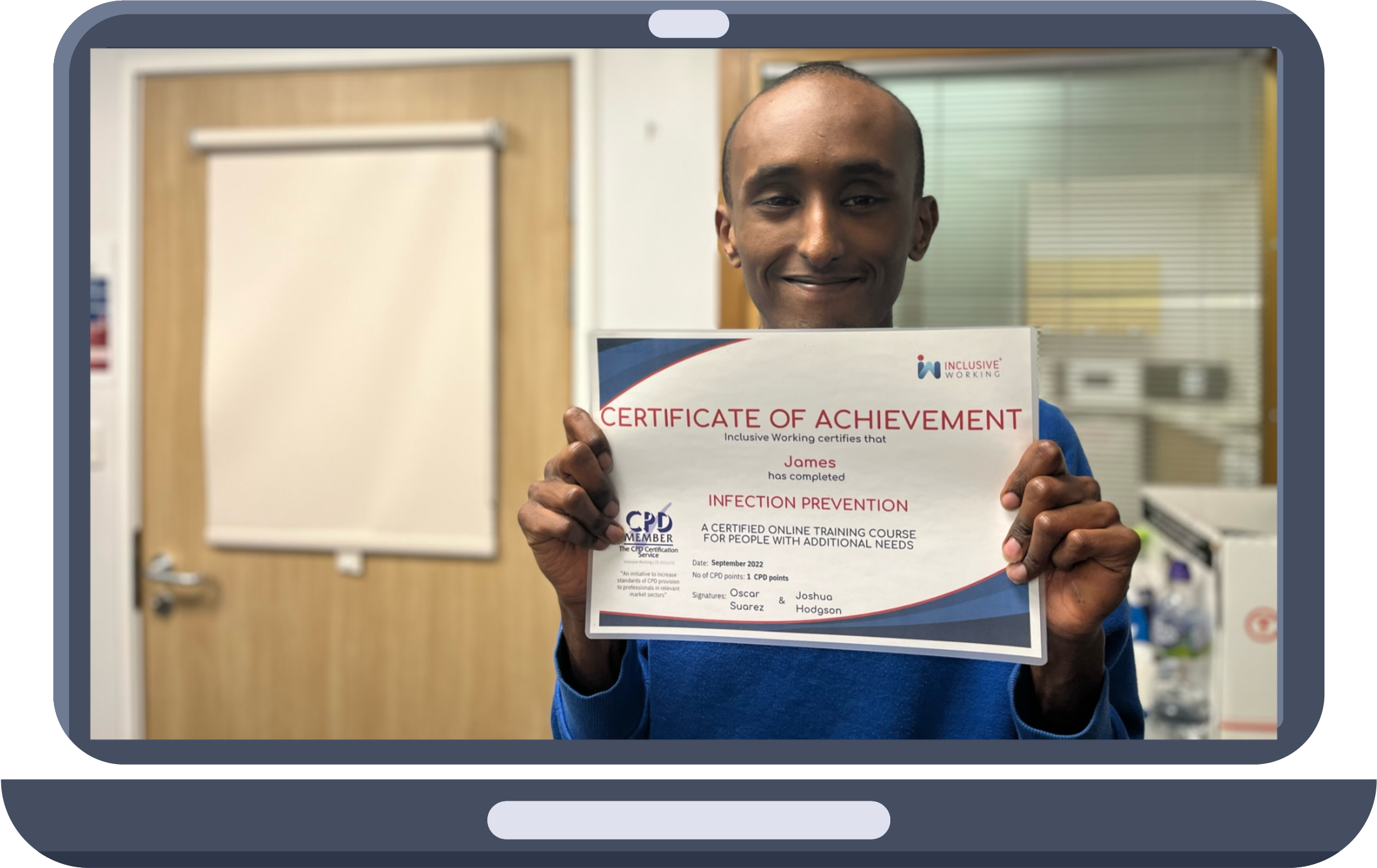 An individual holding their certificate after completing an eLearning module in Infection Prevention