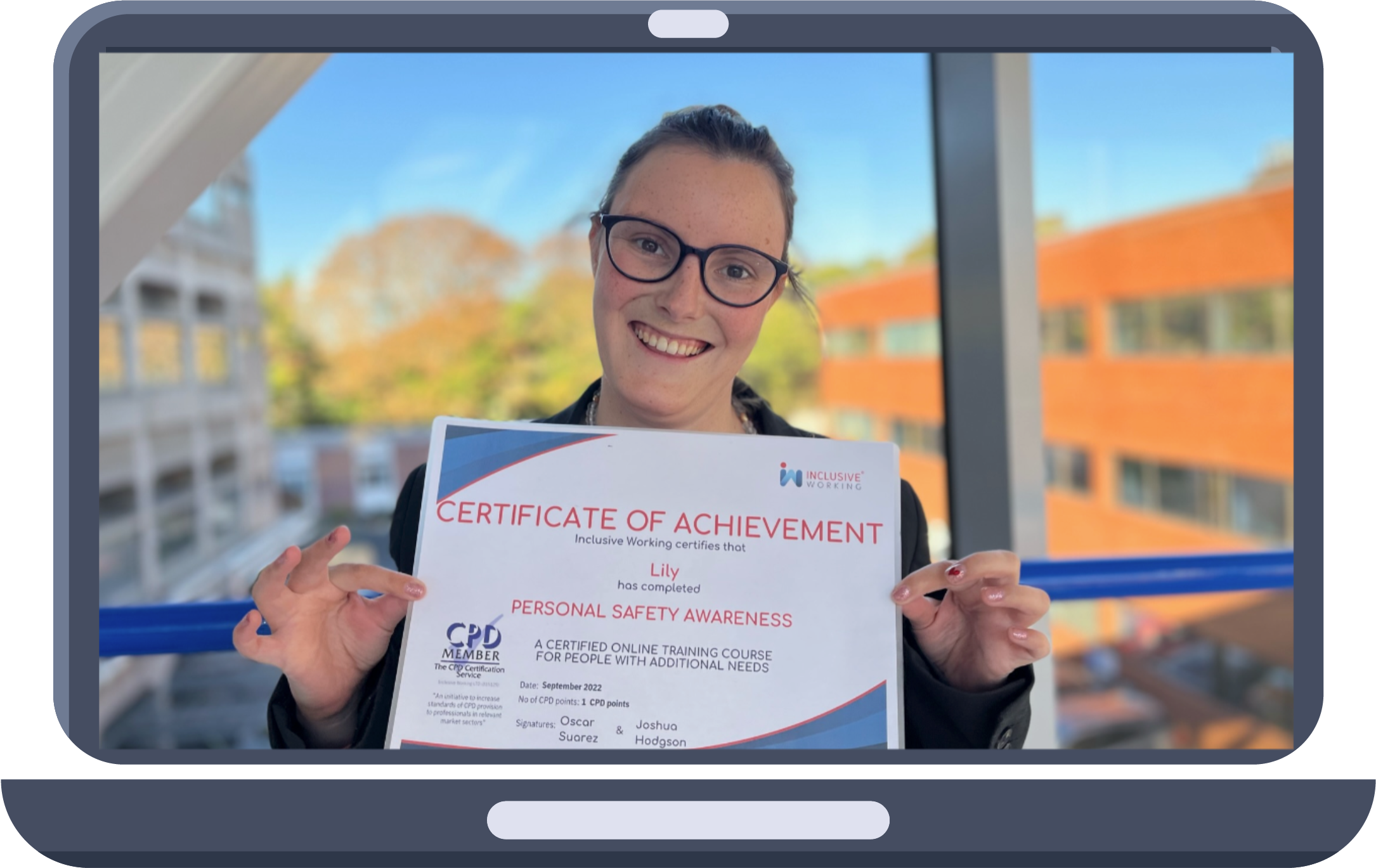An individual holding a certificate after completing an eLearning module